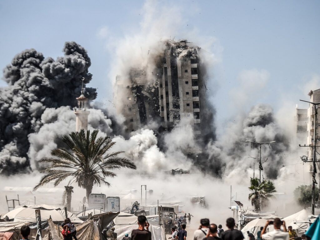 israel-blows-up-gaza-city-high-rise,-escalating-deadly-assault