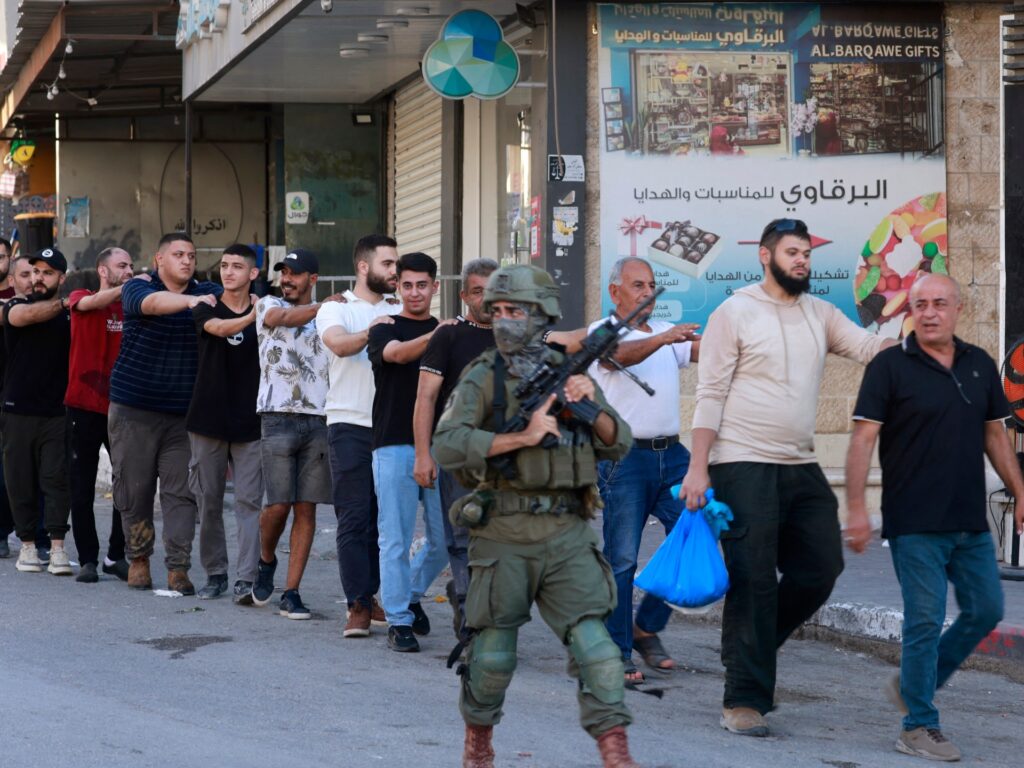 israeli-forces-arrest-over-100-palestinians,-impose-curfew-in-west-bank