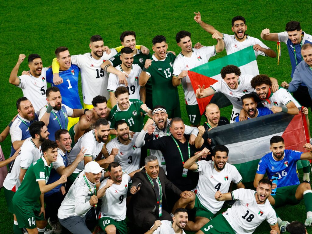 gritty-palestine-enter-arab-cup-quarters-as-favourites-qatar-crash-out
