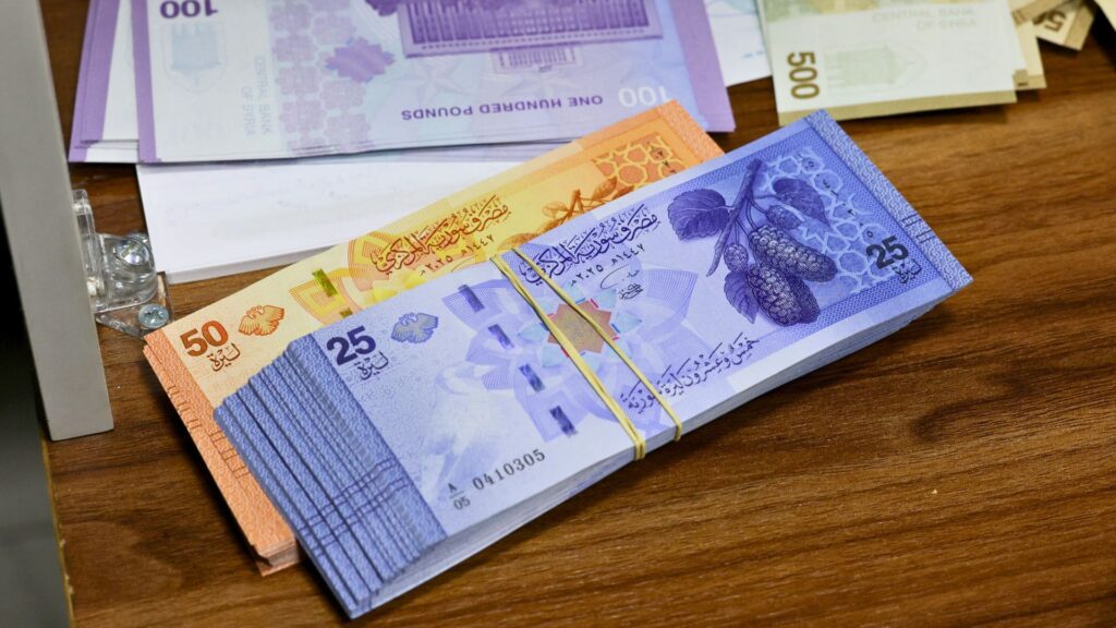 syria’s-new-currency-removes-al-assad-family-images,-seeks-to-boost-economy