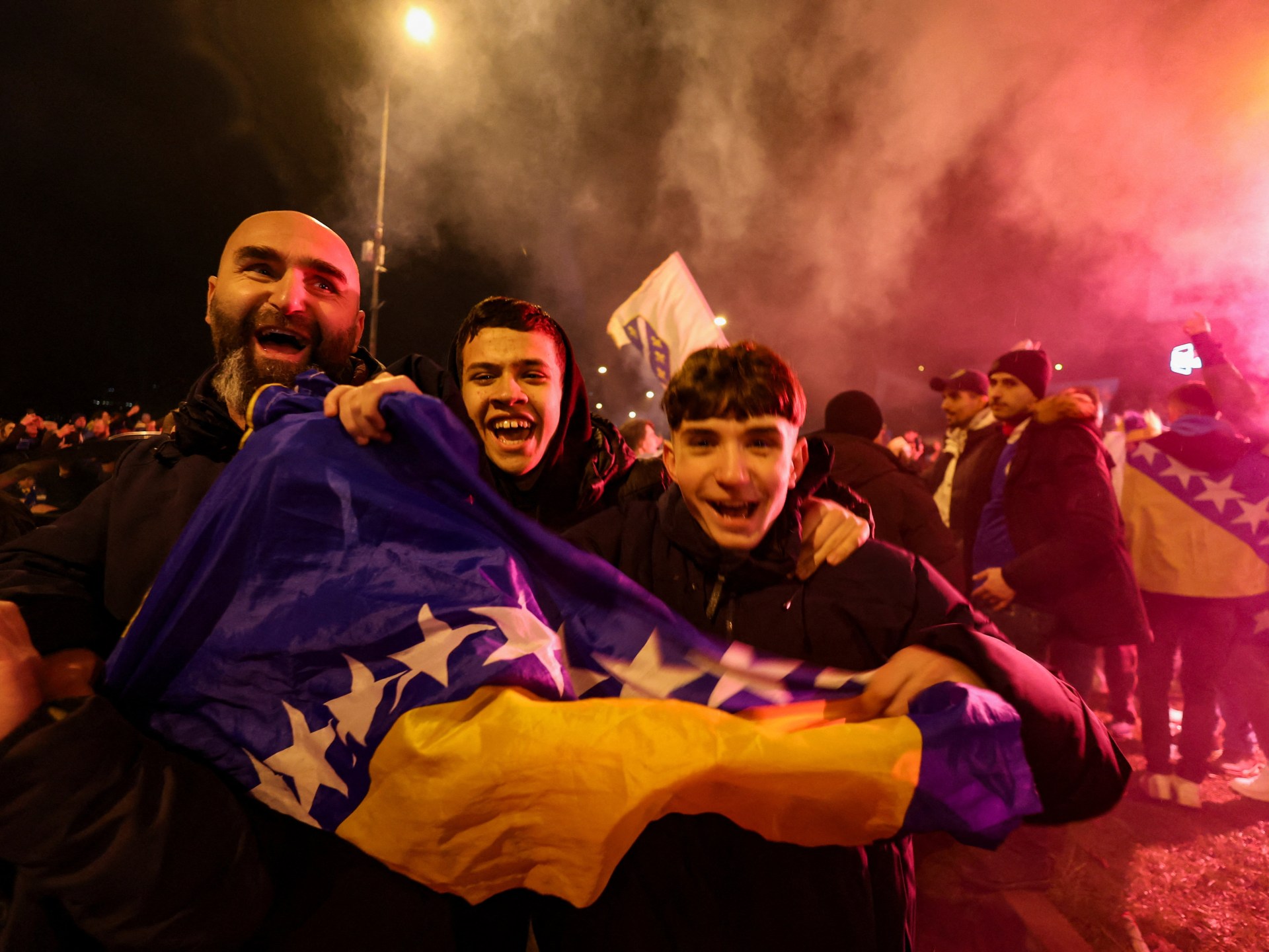 bosnia-fans-celebrate-as-team-qualifies-for-world-cup,-knocking-italy-out