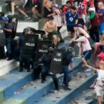 fans-fight-police-at-paraguay-football-match