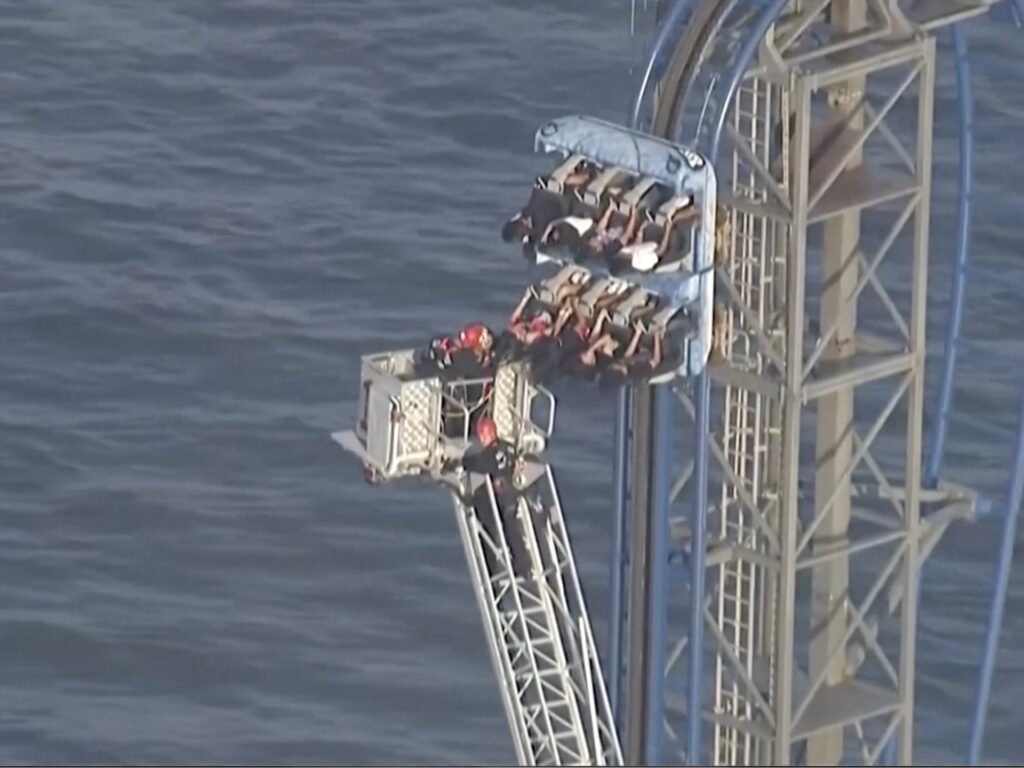 firefighters-work-to-free-riders-stuck-atop-a-rollercoaster-in-texas