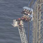 firefighters-work-to-free-riders-stuck-atop-a-rollercoaster-in-texas