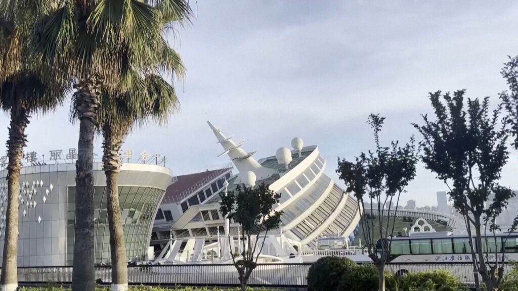 cruise-ship-hotel-left-listing-in-china-port-after-high-tides